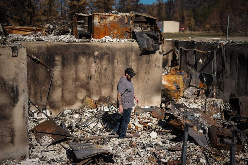 Joel Patan walks through the basement of his home that was destroyed by the Bald Range wildfire near Faulder, west of Summerland, B.C..