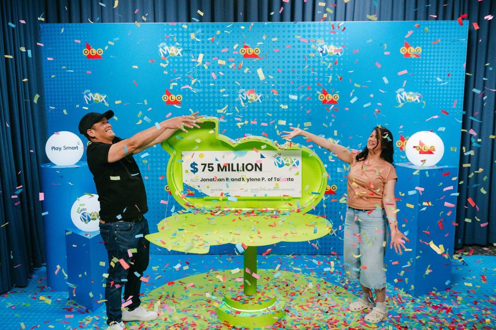 Jonathan R. and Mylene P. throwing confetti at each other during a winner celebration