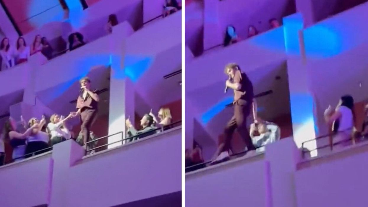 Joshua Bassett climbing a balcony at his Vancouver concert.