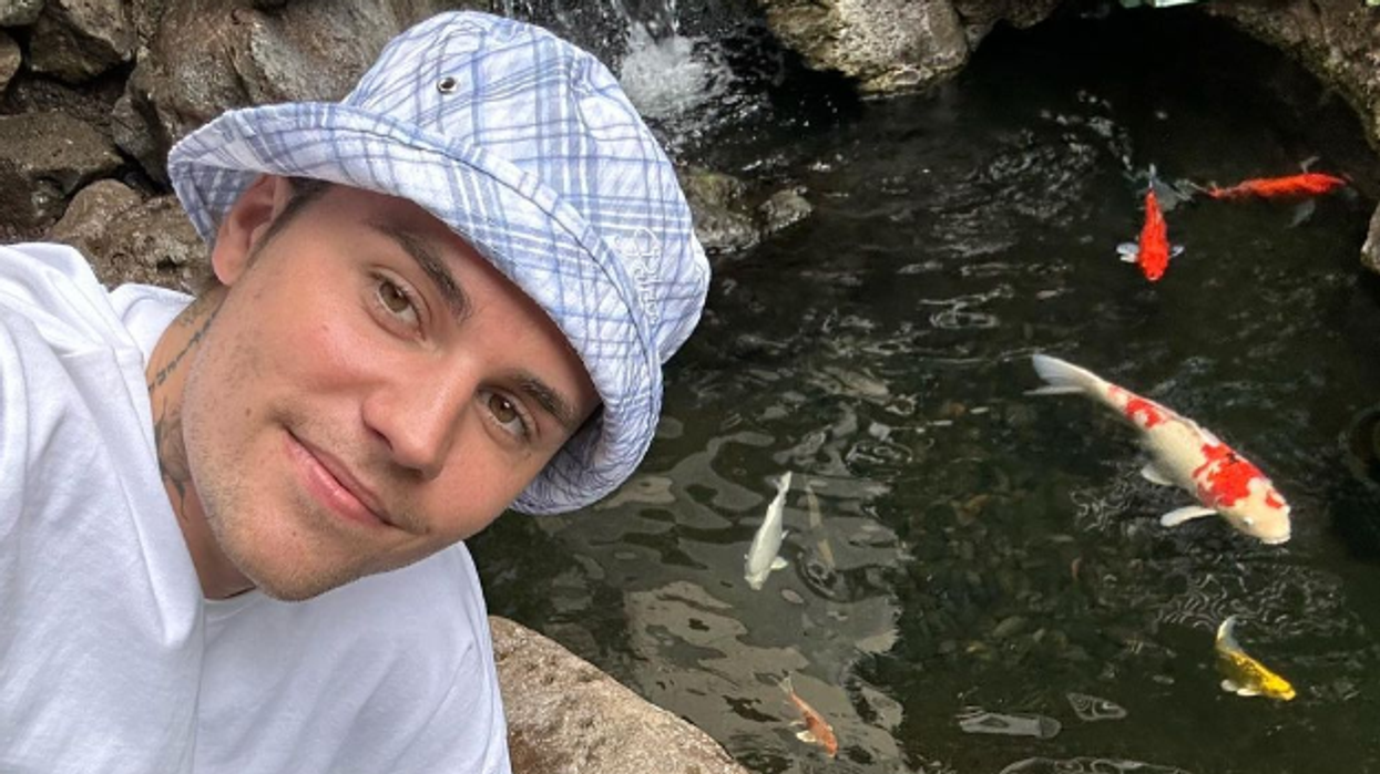 Justin Bieber taking a selfie.