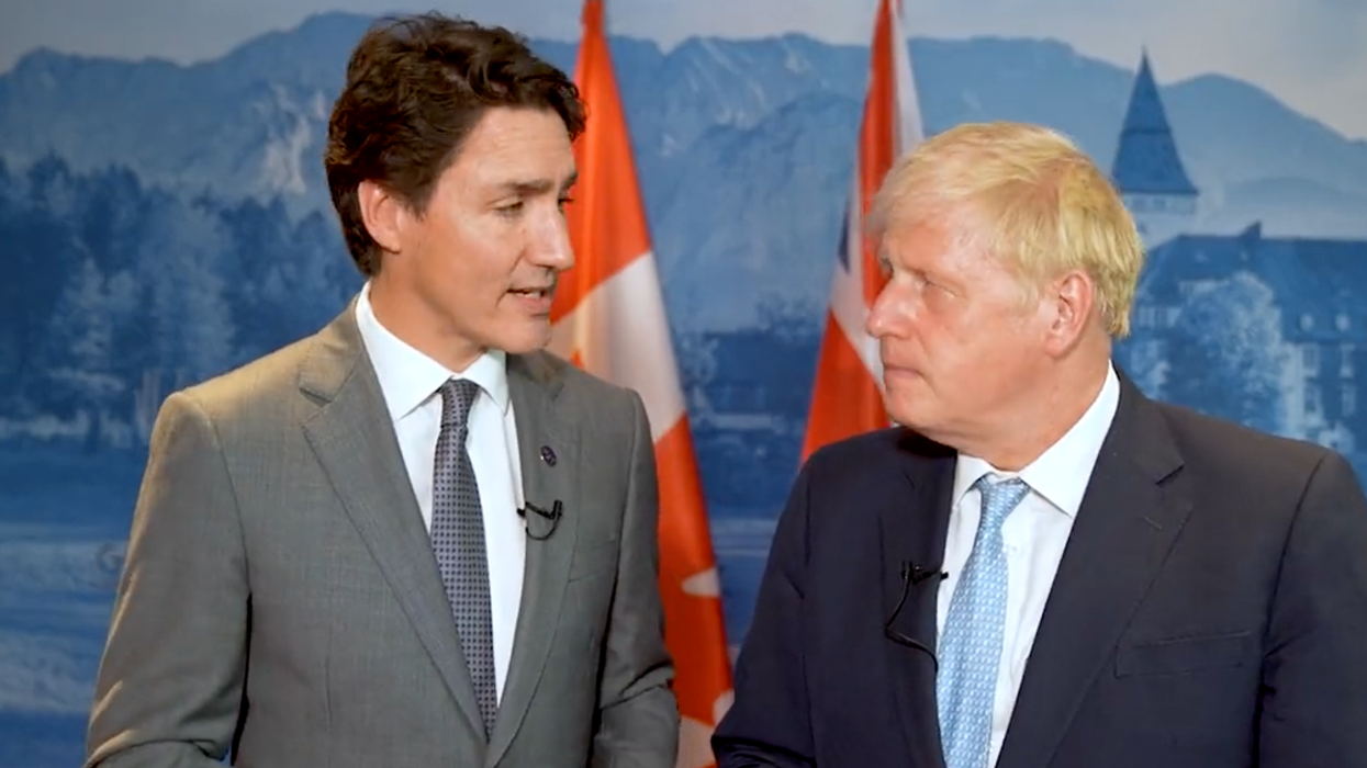 Justin Trudeau and Boris Johnson standing together at the G7 summit in Germany.