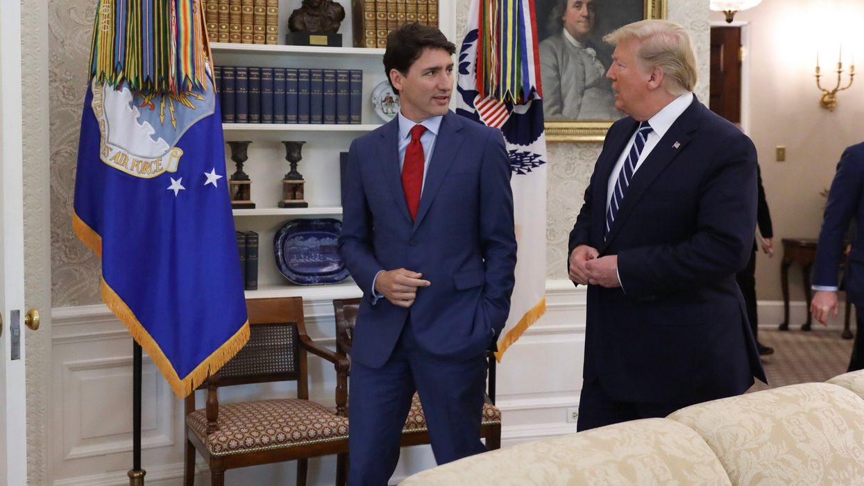justin trudeau and donald trump walking beside each other in the white house