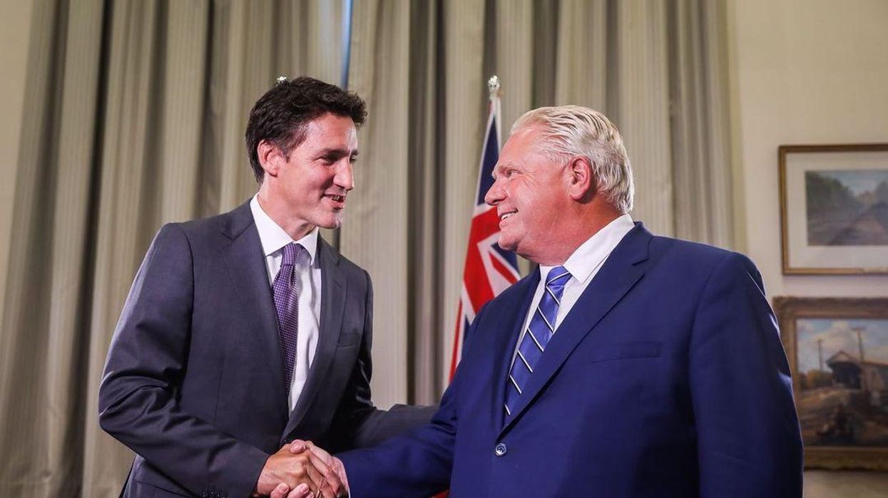 Justin Trudeau & Doug Ford shaking hands.
