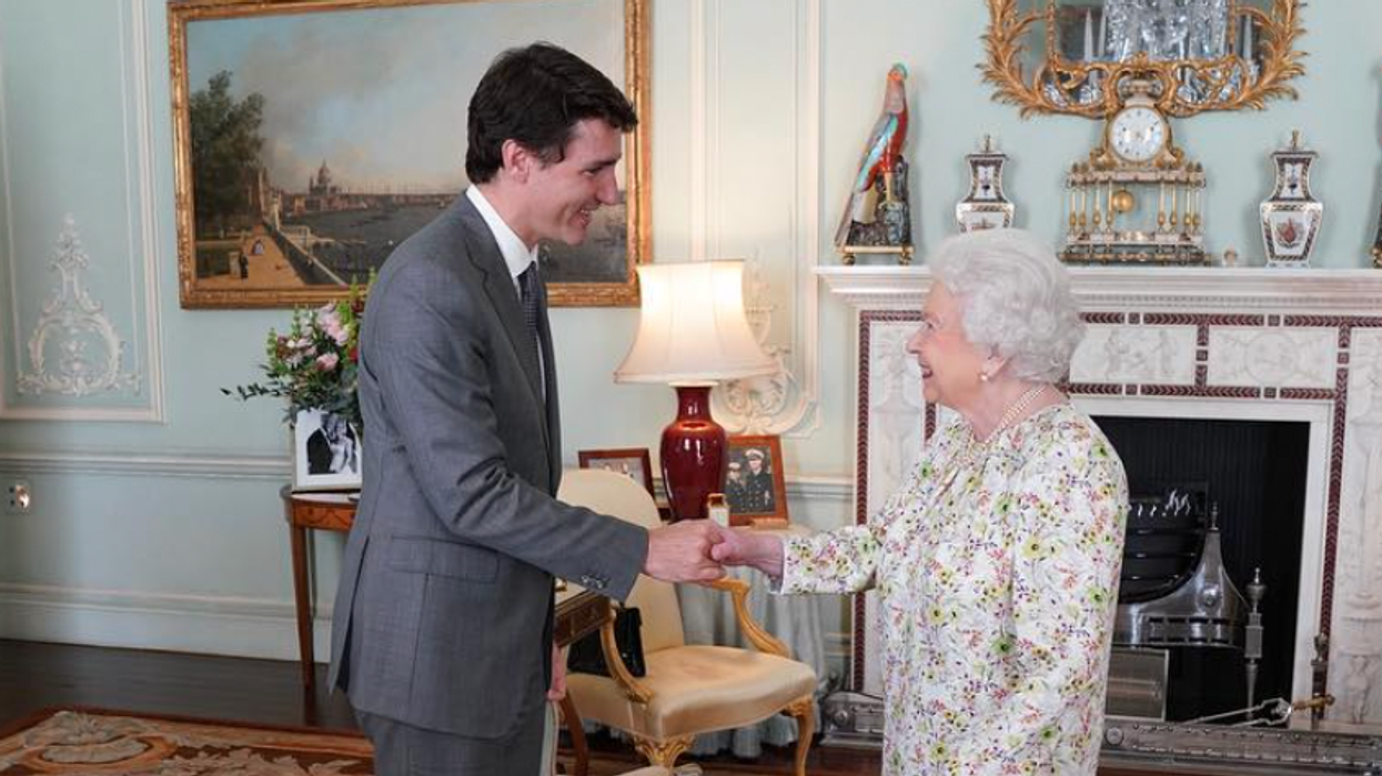 Justin Trudeau shaking hands with Queen Elizabeth II at Buckingham Palace.