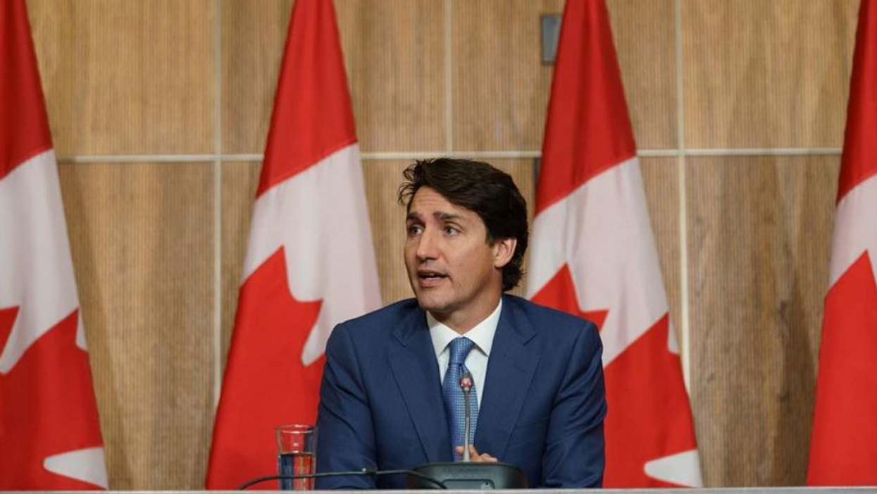 Justin Trudeau sitting at a desk.