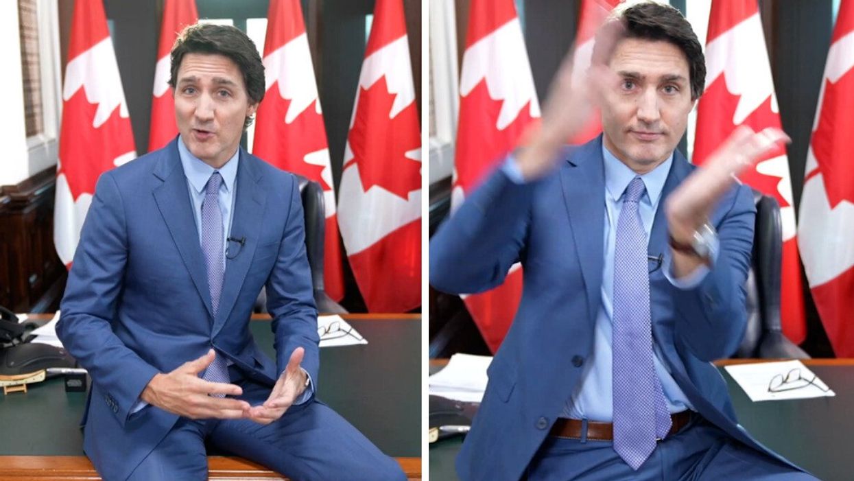 Justin Trudeau sitting on his desk in his office during a YouTube video.