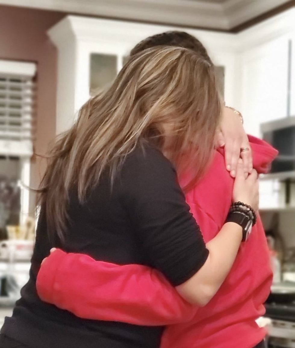 Karen Habashi hugging her daughter. 