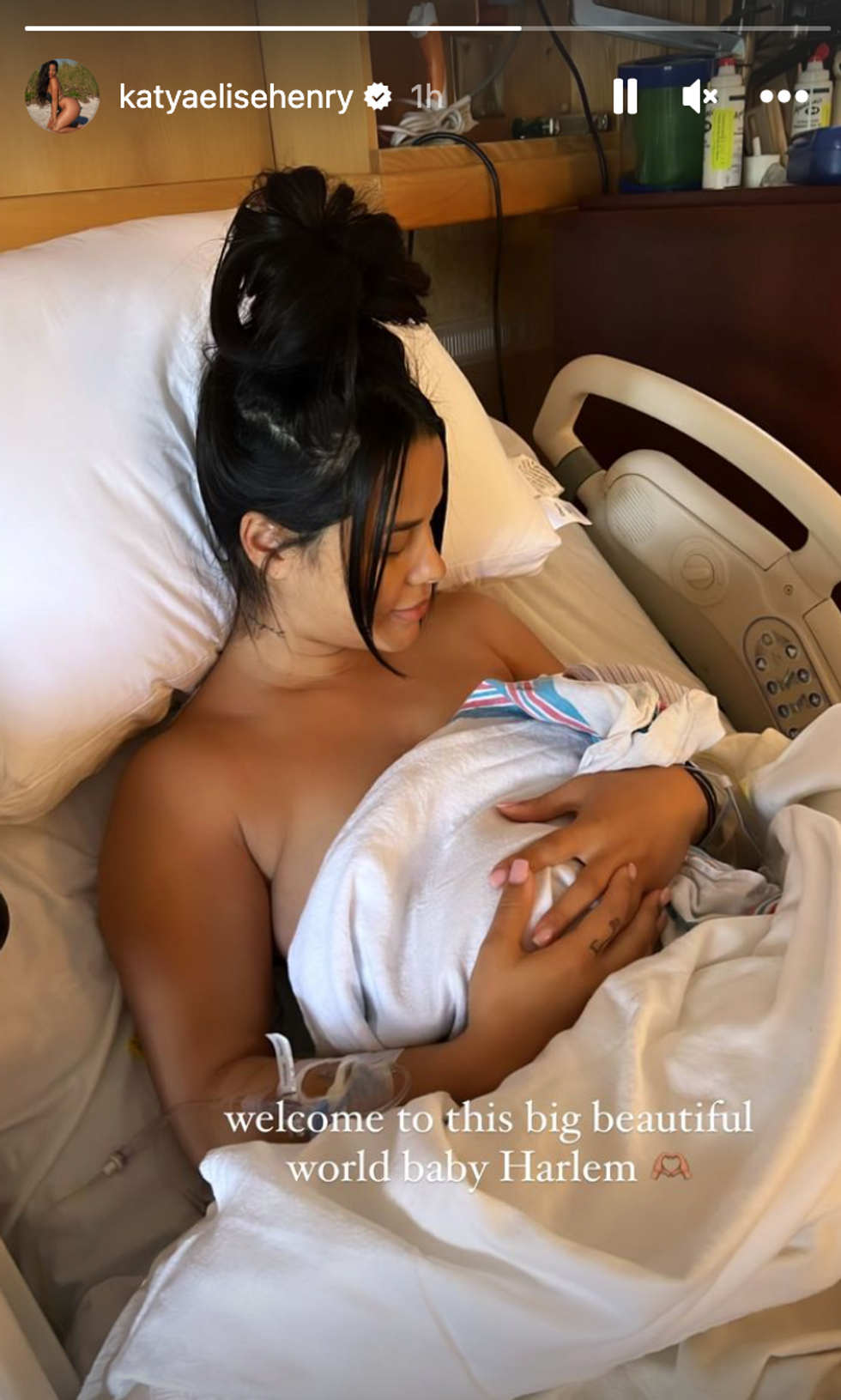 Katya Elise Henry holding her son, Harlem.