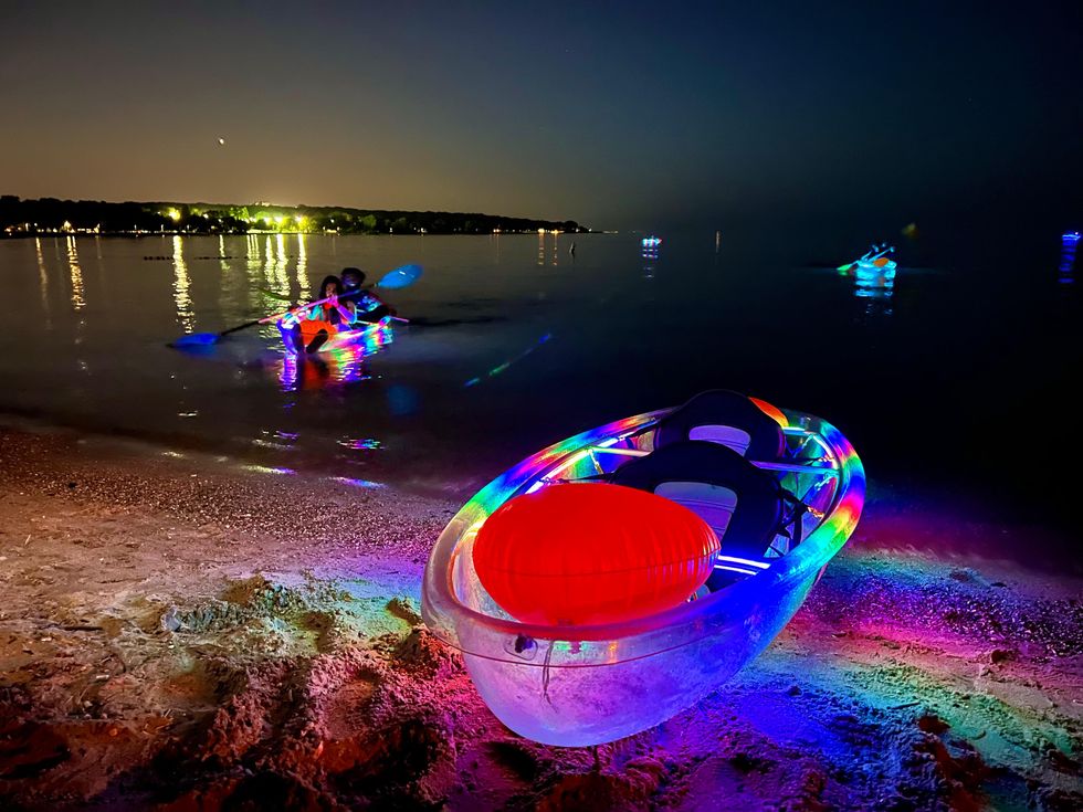 Kayak with rainbow lights on the shores of Woodbine Beach.