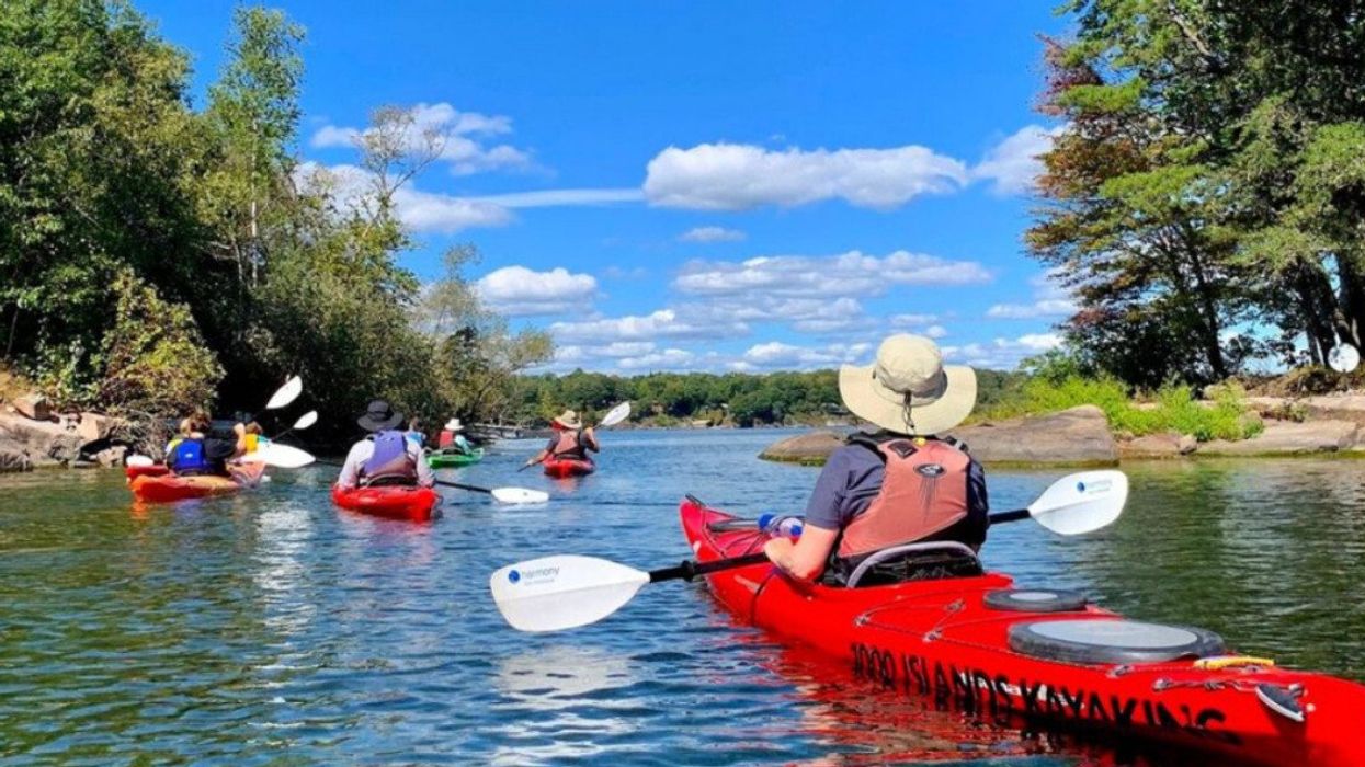 Kayakers paddling between islands.
