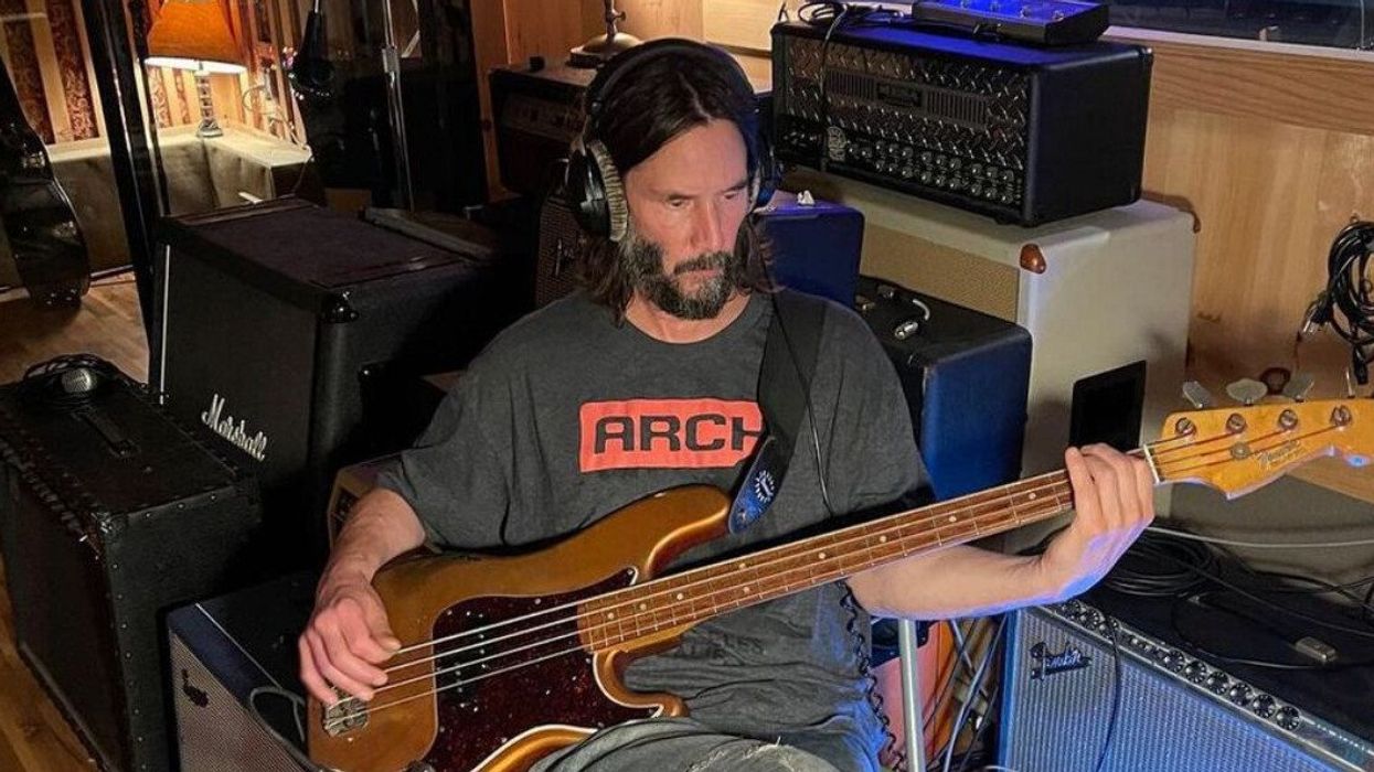 Keanu Reeves playing bass.