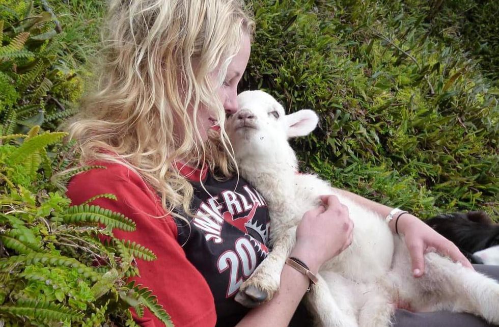 Kelly Green with a lamb.