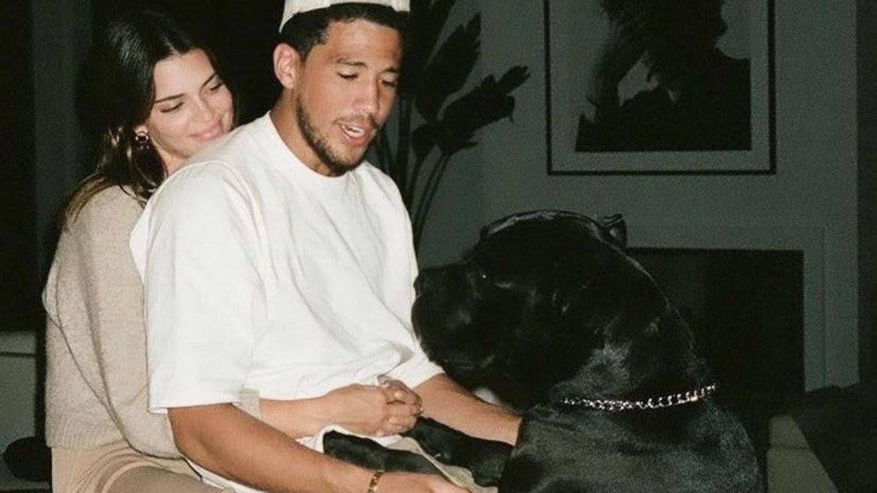 Kendall Jenner and Devin Booker with a Dog.