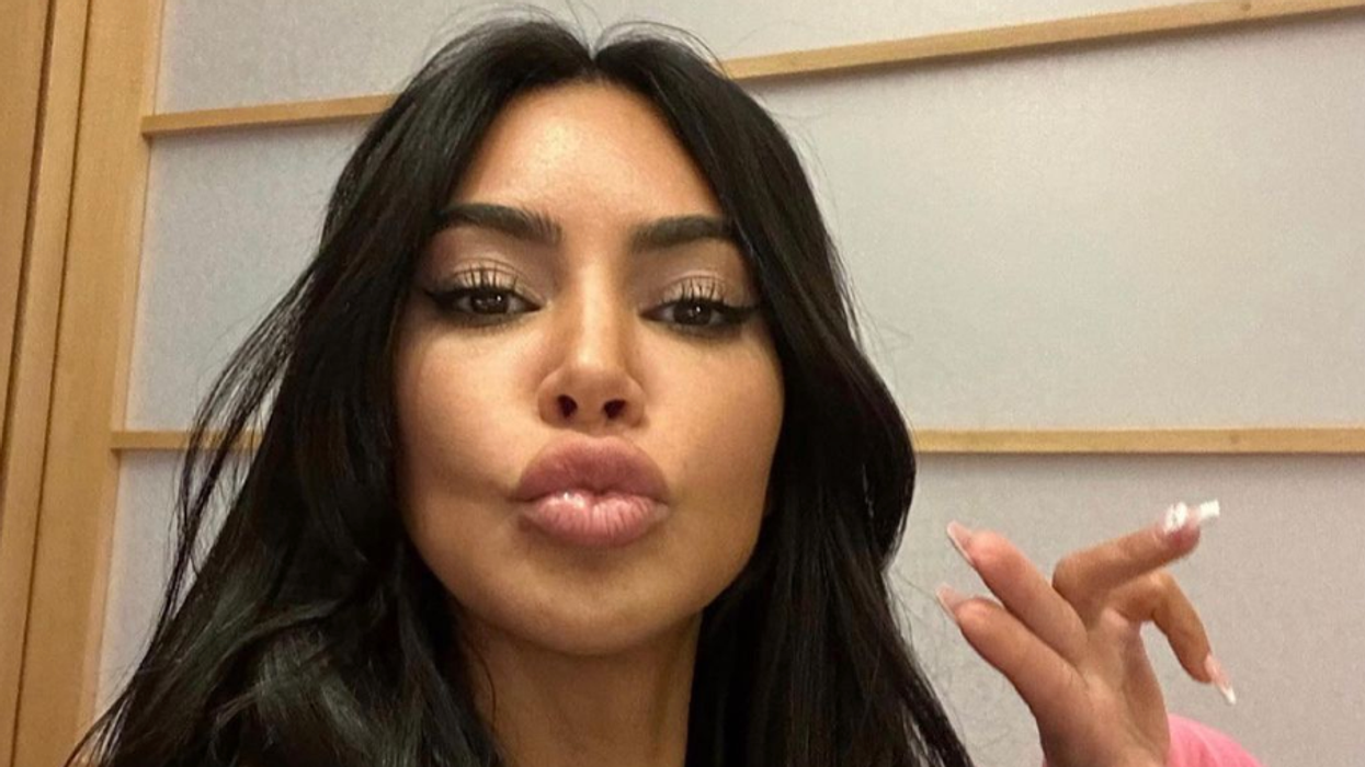 Kim Kardashian taking a selfie.