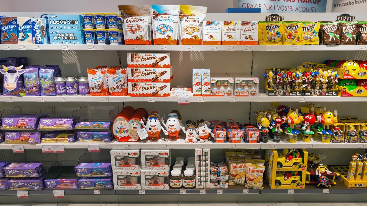 Kinder chocolates on shelves at a grocery store.
