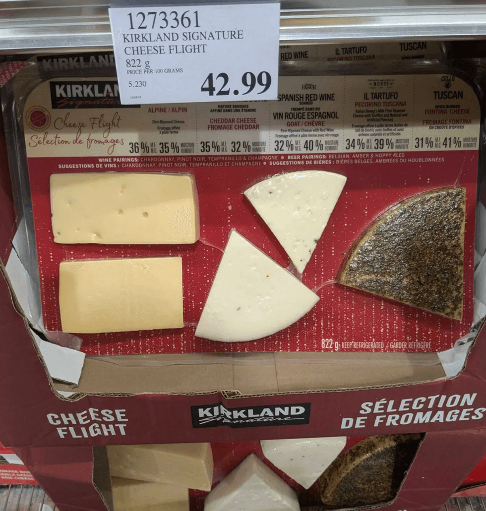 Kirkland cheese flight with various cheeses, price tag reads $42.99.