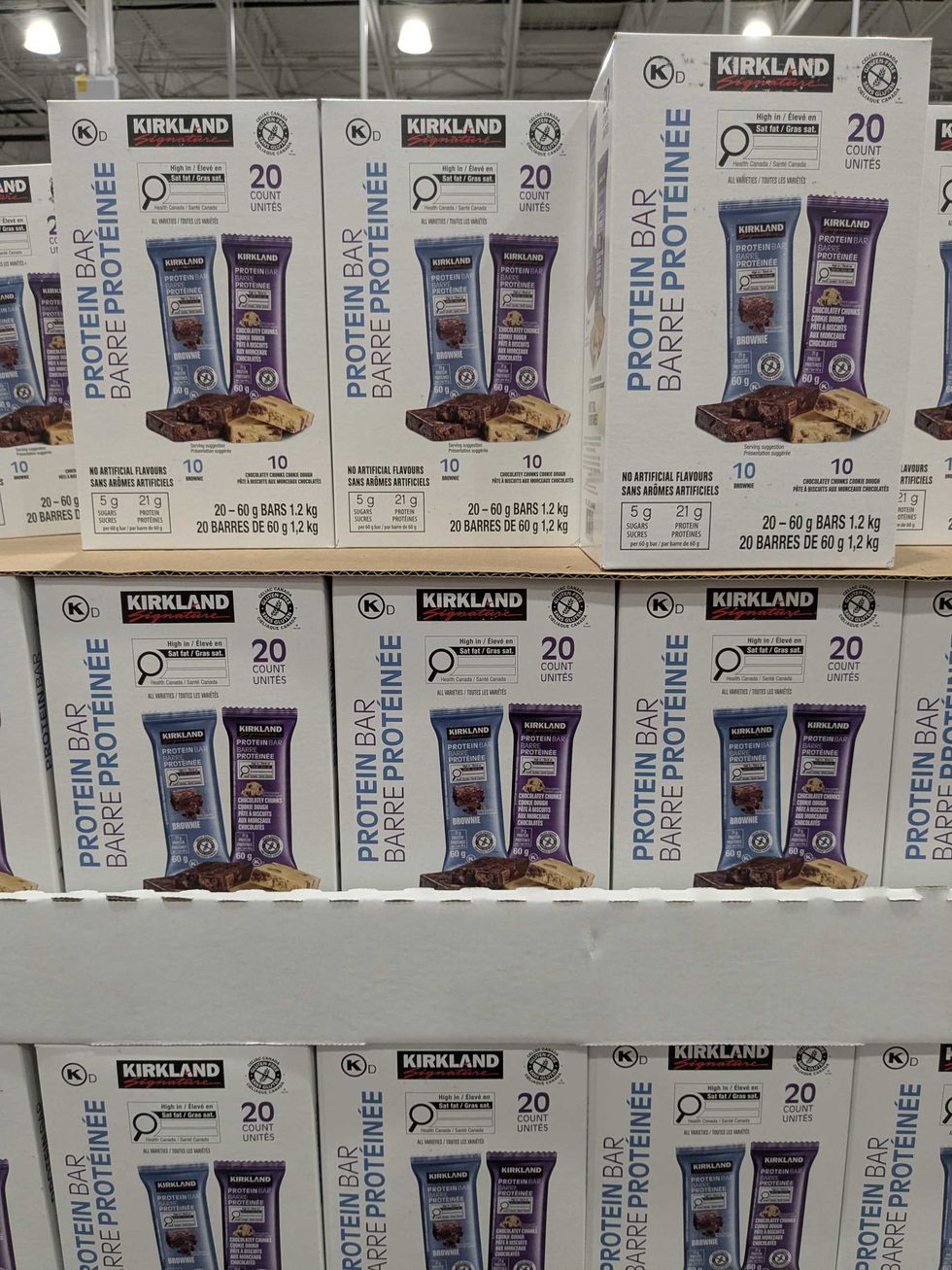 Kirkland signature protein bars stacked on shelves