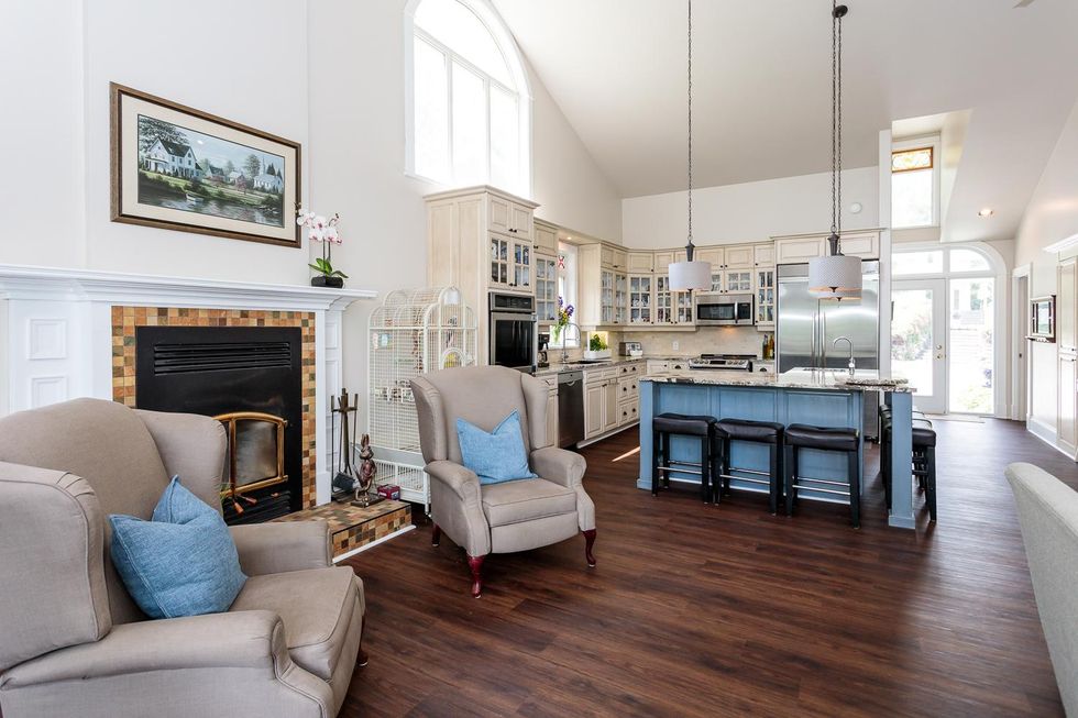Kitchen and fireplace seating in wing addition of mansion.