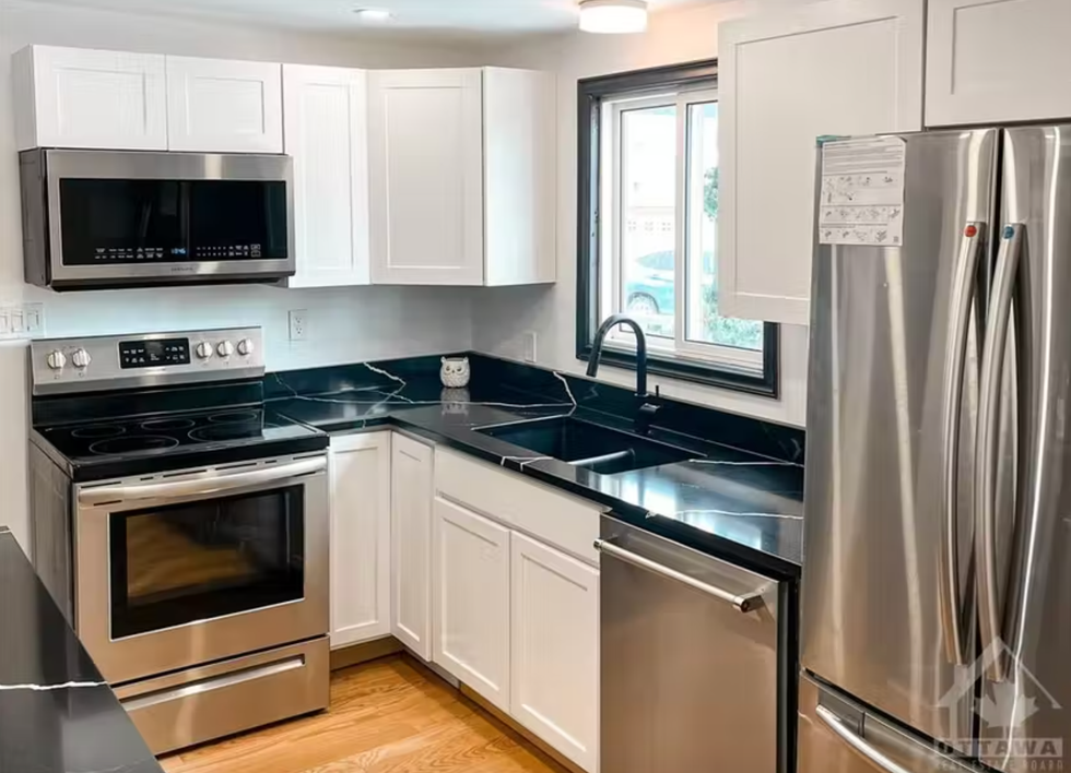 Kitchen counters and stainless steel appliances.