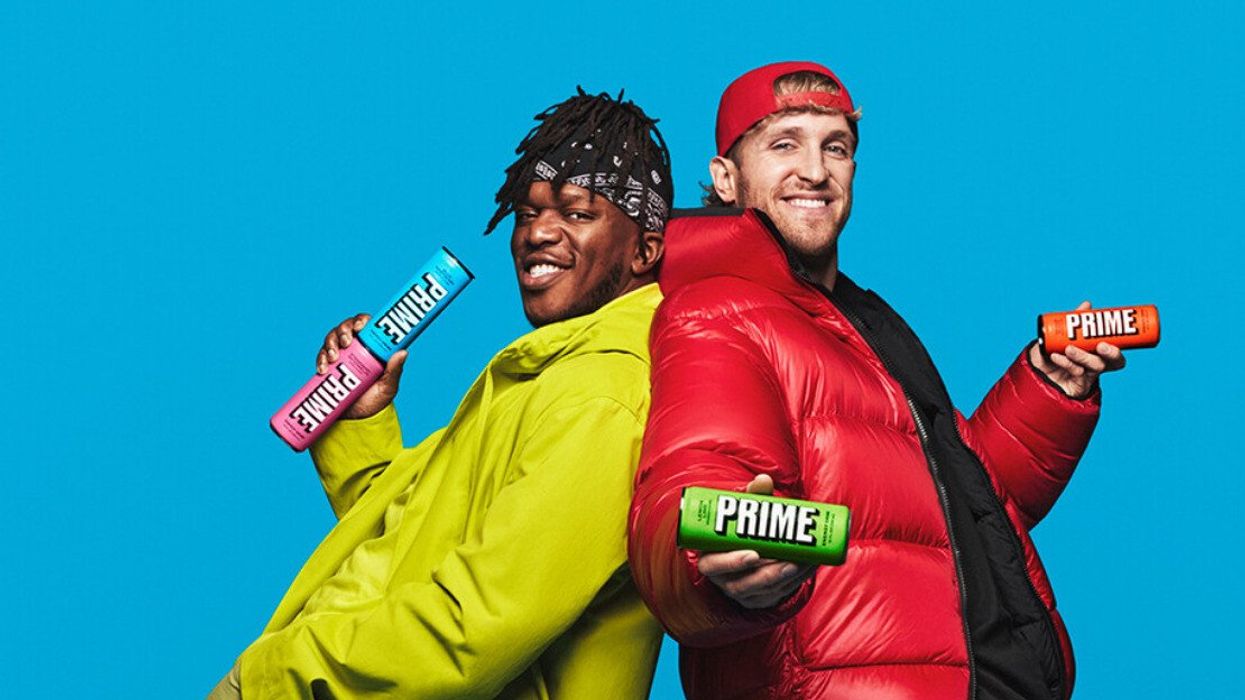 KSI and Logan Paul holding cans of Prime Energy drinks.