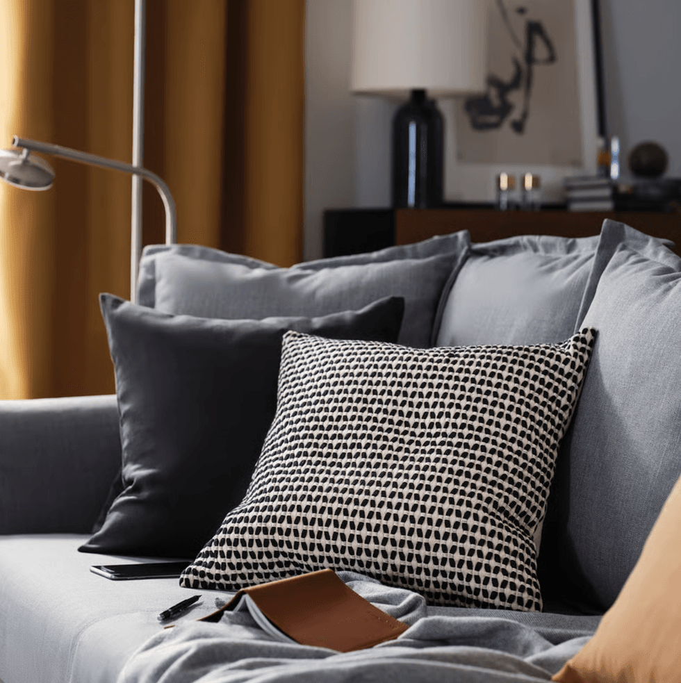 KUSTFLY cushion cover on an IKEA Canada sofa.