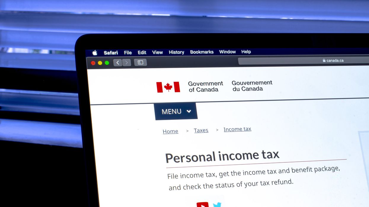 Laptop screen open to the Personal Income Tax page on the CRA website.