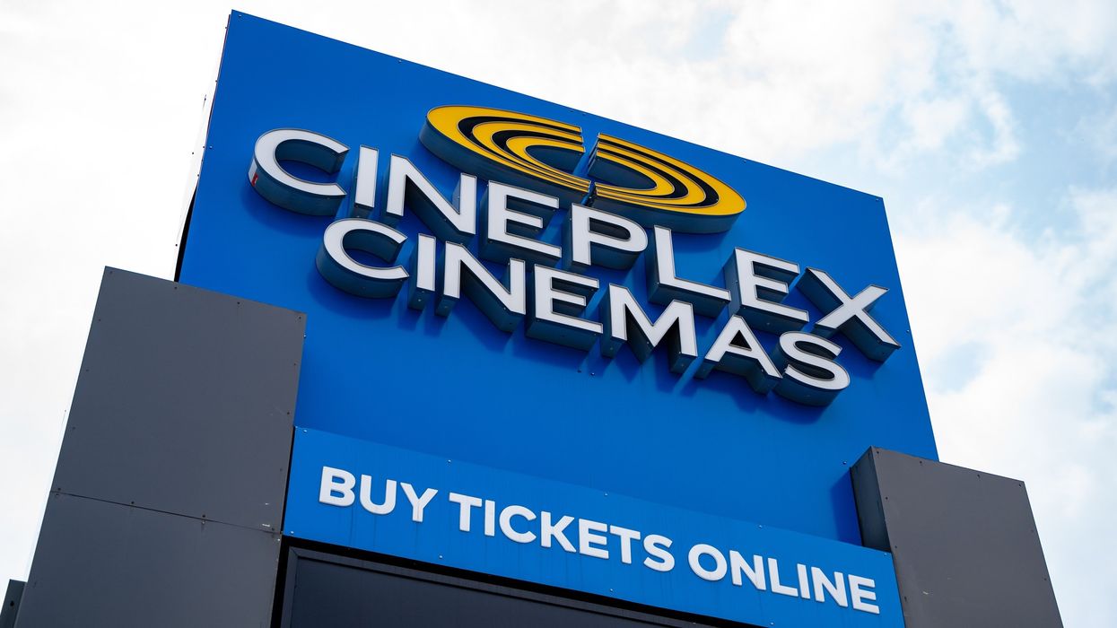 Large blue sign reading "Cineplex Cinemas - buy tickets online."