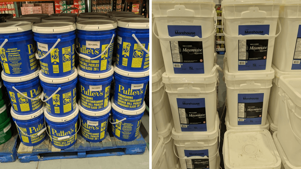 Large tubs of kosher dill pickles and mayonnaise on display in Costco.