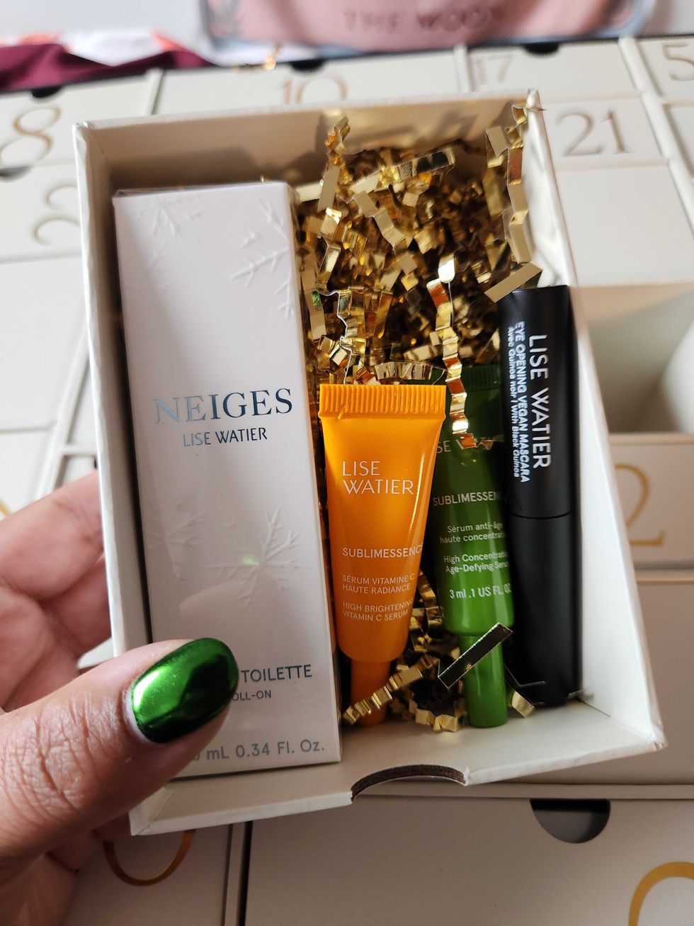 Lise Watier Neiges Eau De Toilette Roll On, Lise Watier Sublimessence High Concentration Age-Defying Serum, Lise Watier Sublimessence High Brightening Vitamin C Serum and Lise Watier \u200bEye Opening Vegan Mascara with Black Quinoa.