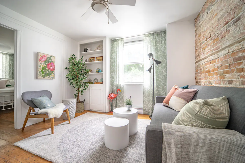Living room with exposed brick wall.