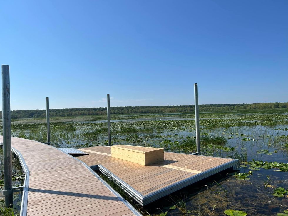 Lookout spot with bench off of the new floating boardwalk in Oka National Park.