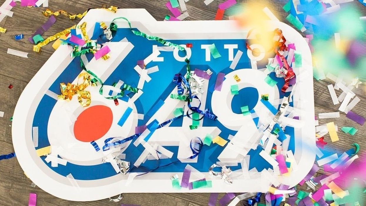 Lotto 6/49 sign covered in confetti.