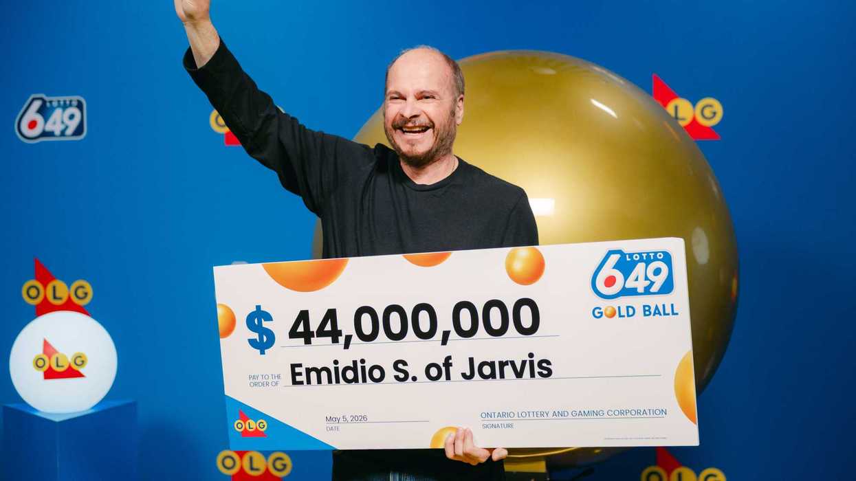 lotto 6/49 winner emidio s holding a $44 million cheque