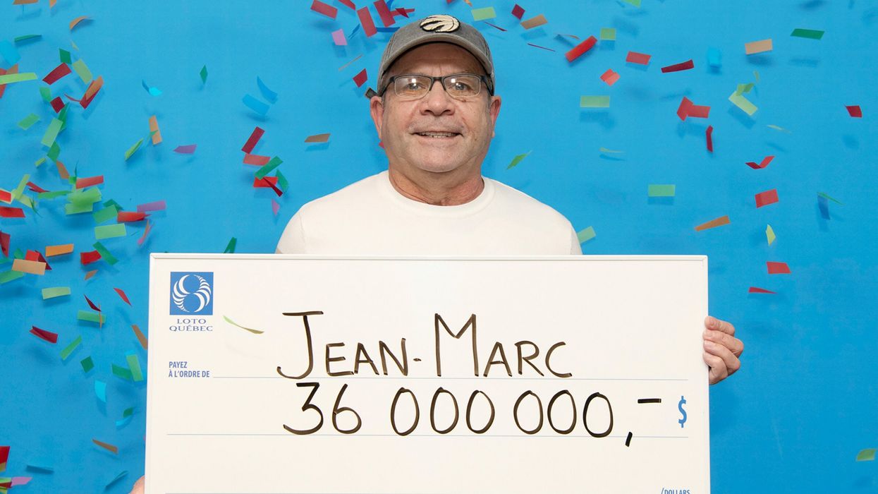 Lotto 6/49 winner Jean-Marc Poirier with his cheque.