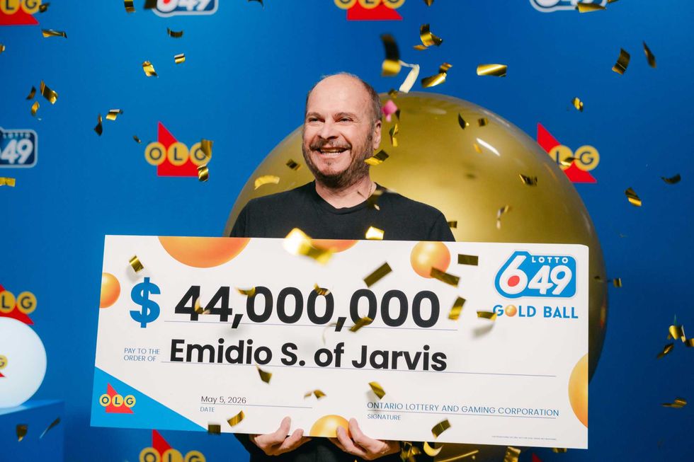 lotto 649 winner emidio s with a $44 million cheque and confetti