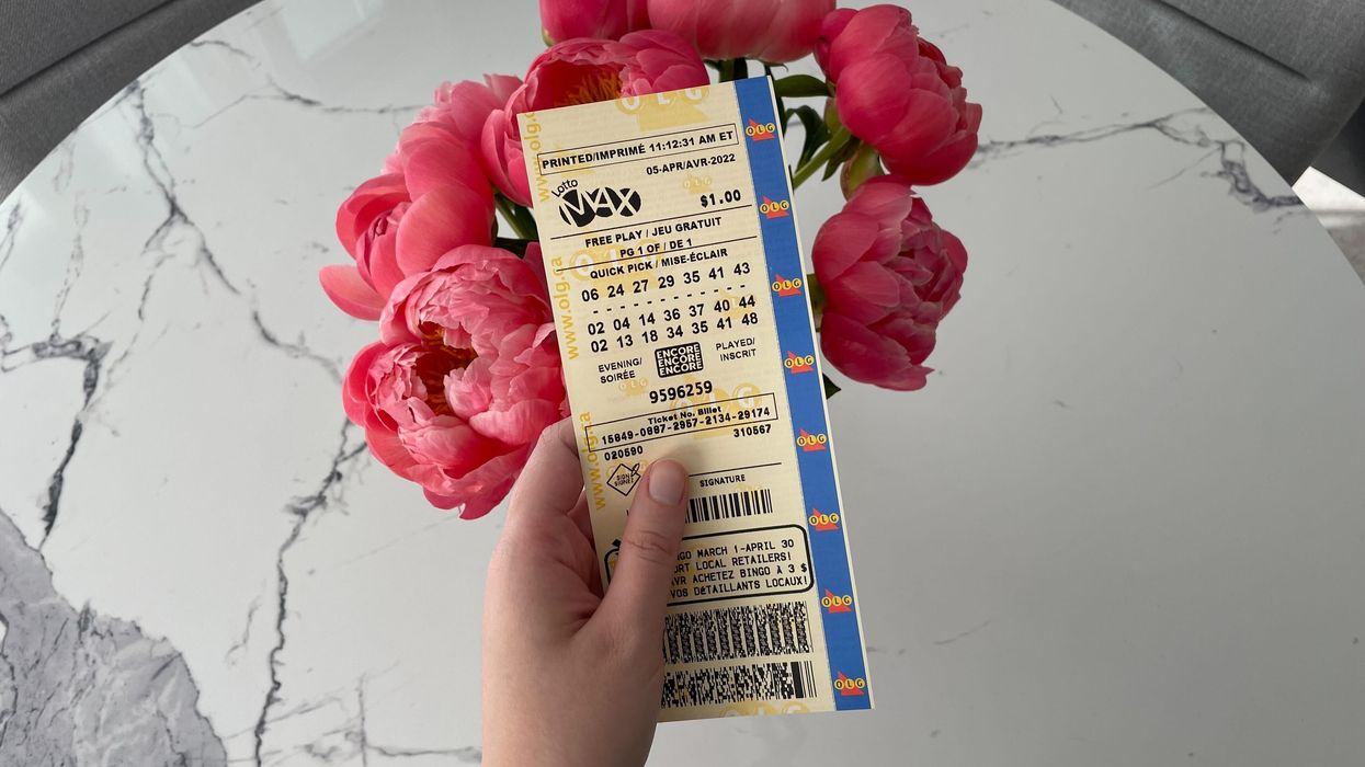 Lotto Max ticket and pink flowers.