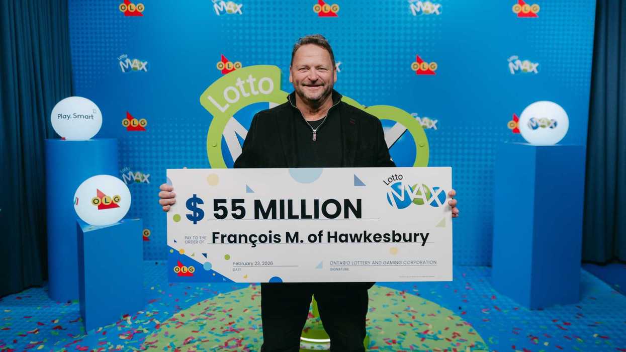 lotto max winner Francois Masse with $55 million cheque