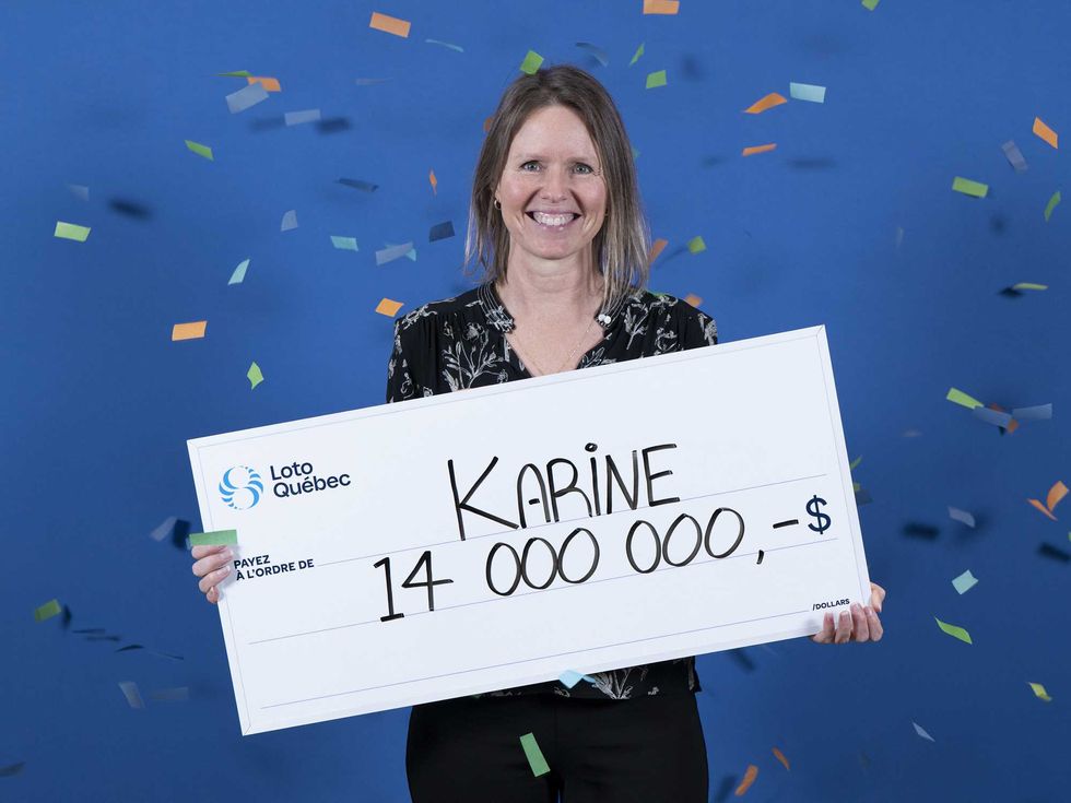 lotto max winner Karine Sirois holding a $14 million cheque