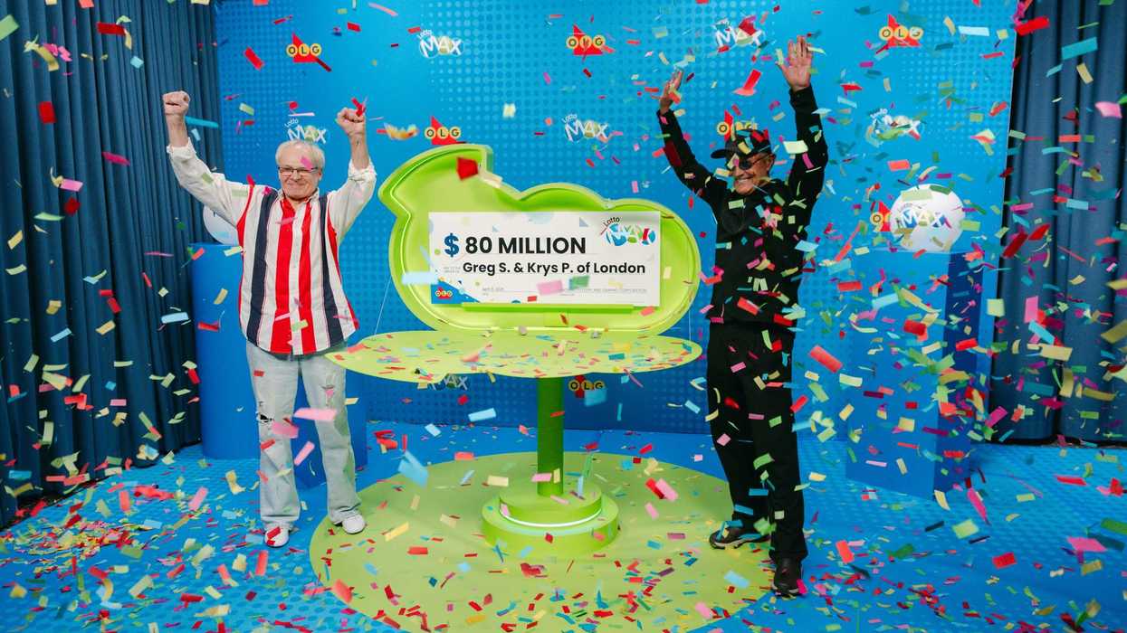 lotto max winners Greg S. and Krys P. with $80 million cheque