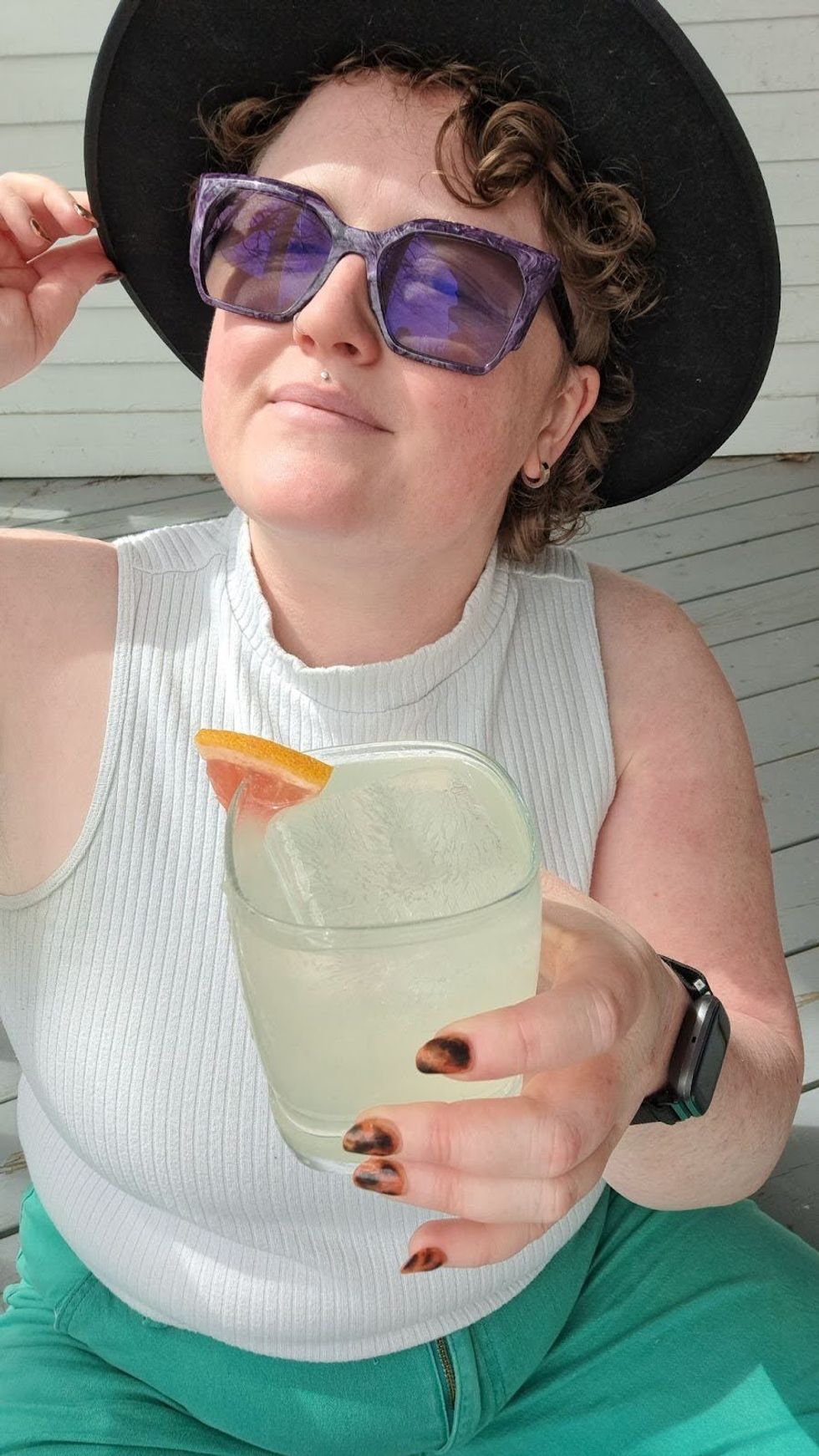 Louie Murray holding a paloma while enjoying the sunshine.