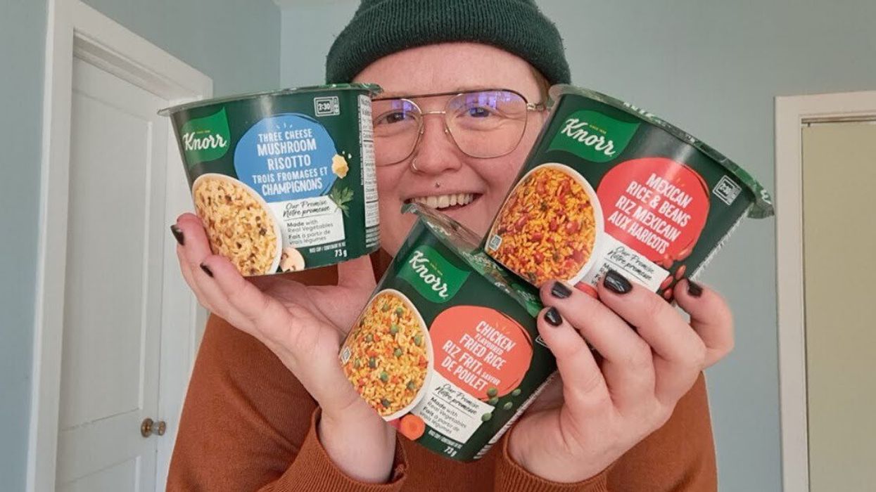Louie Murray holding up the three flavours of Knorr Rice Cups