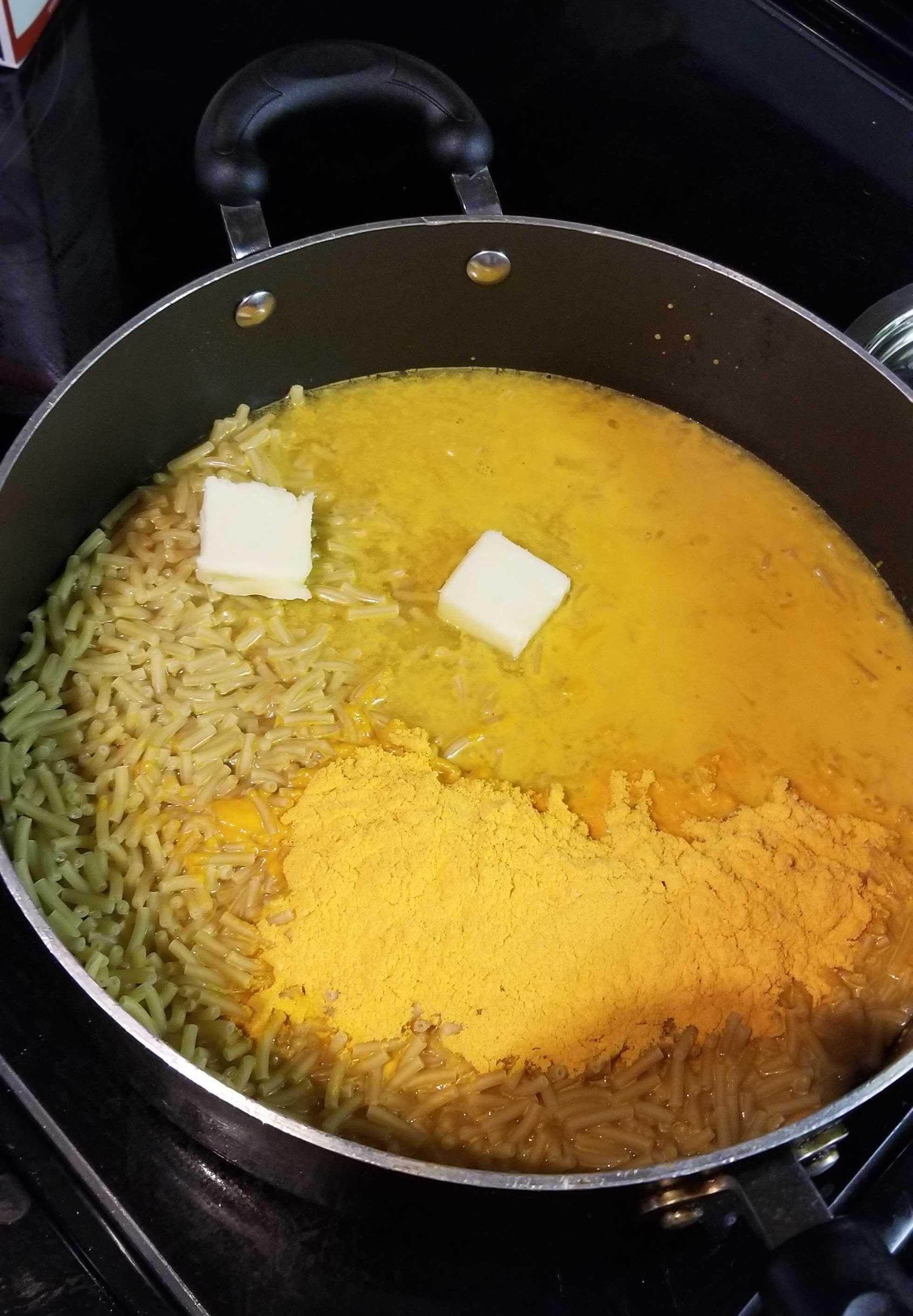 Mac and cheese in a pot with butter.