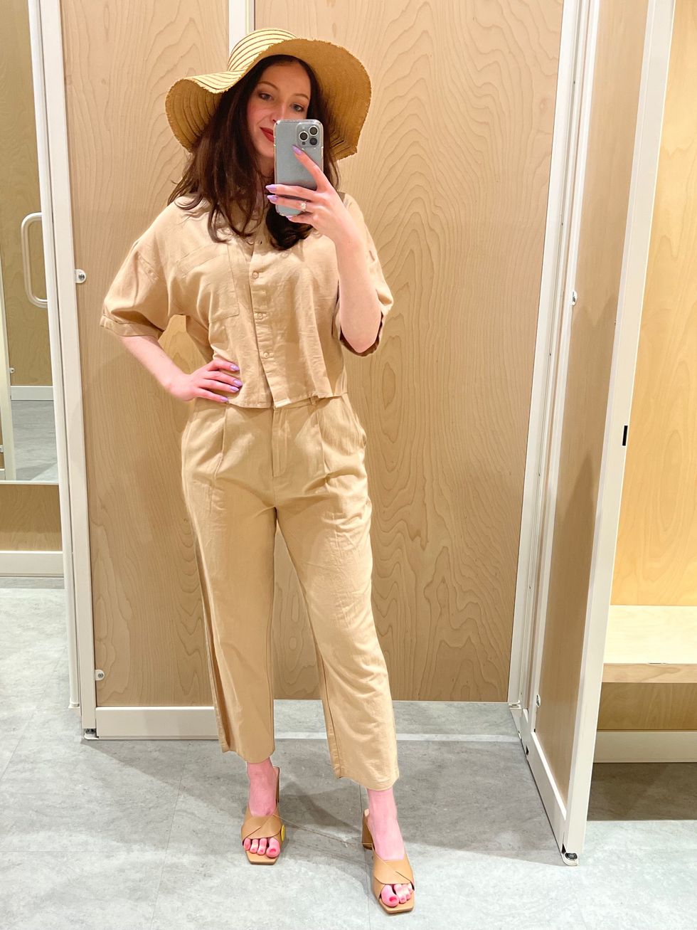 Madeline in a beige outift.