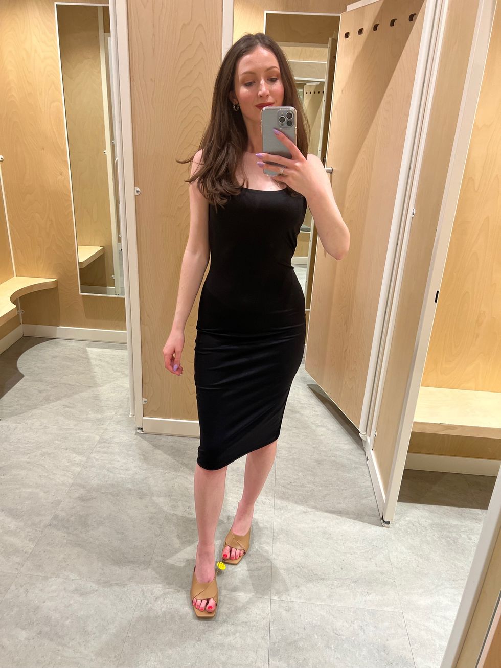 Madeline in a black dress.