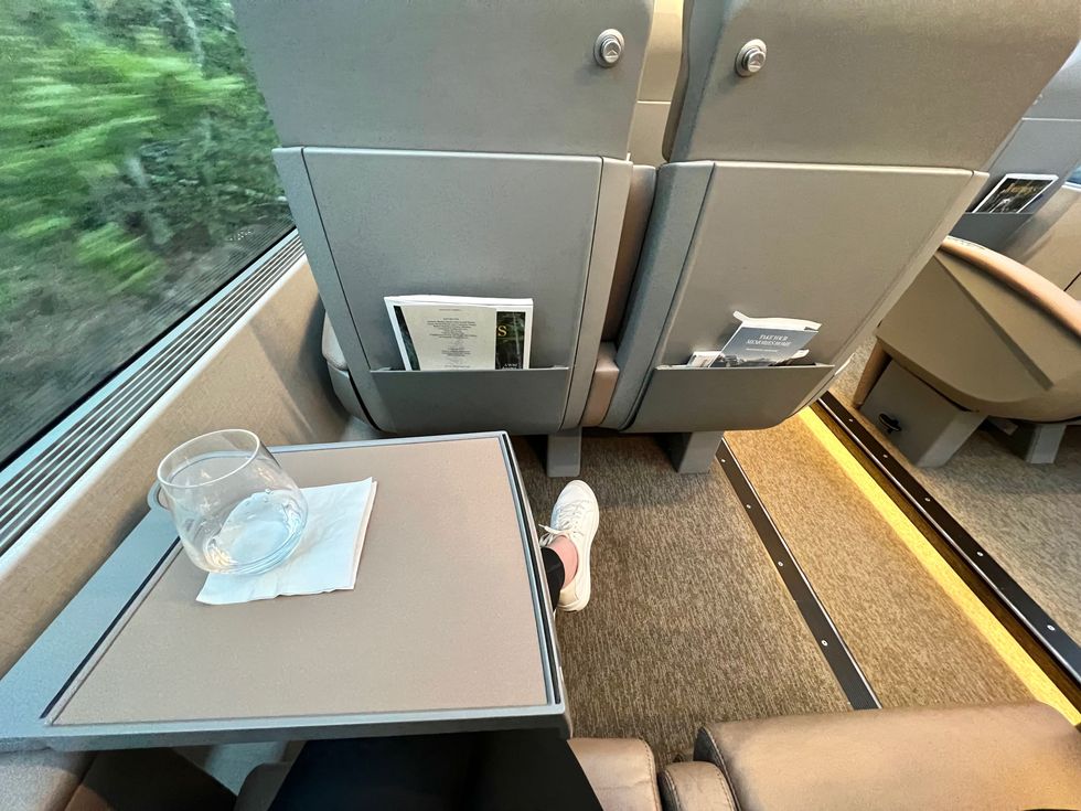 Madeline sitting on board Rocky Mountaineer.