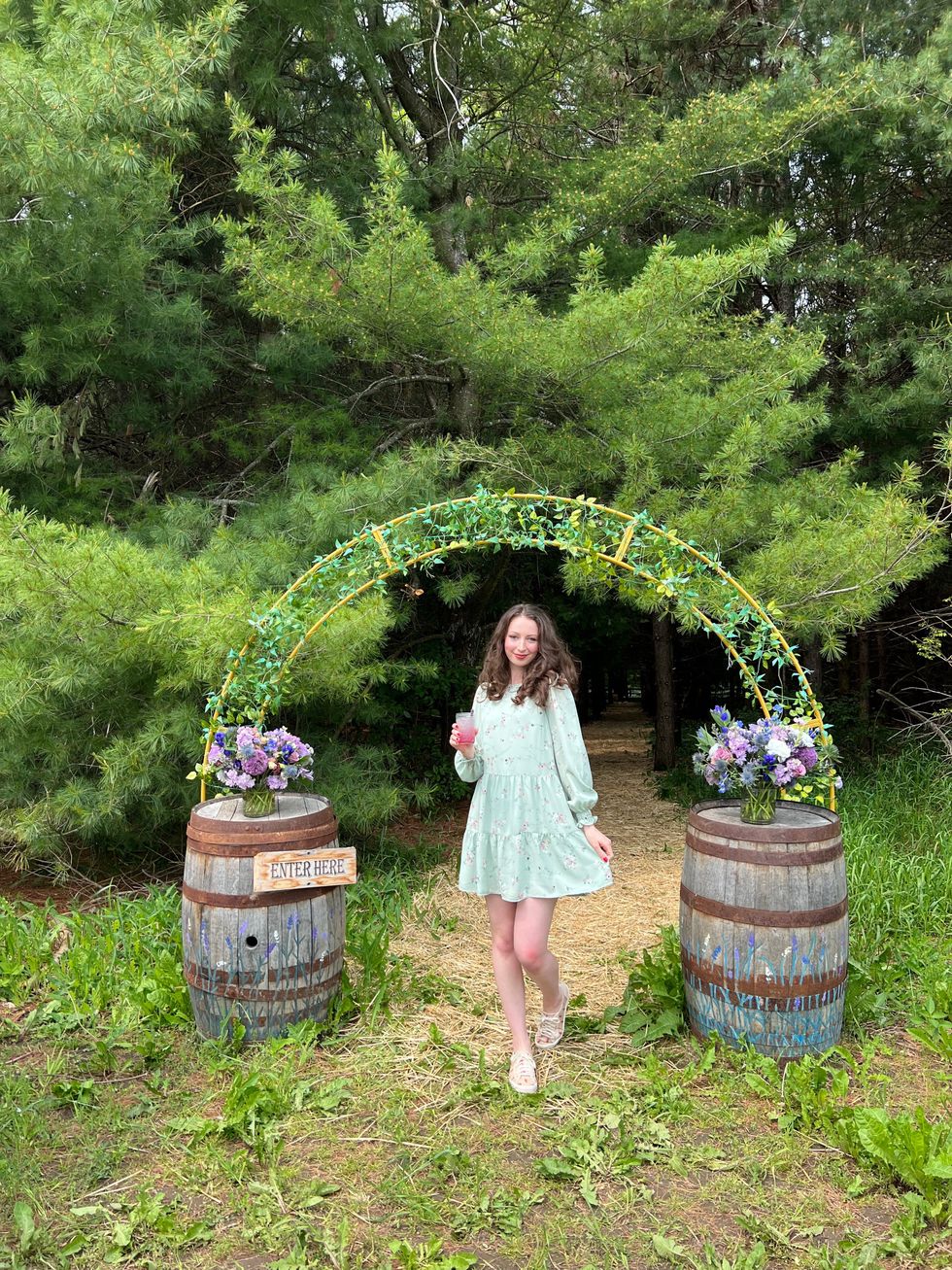 Madeline standing at the entrance to Avalon Lavender Farm.