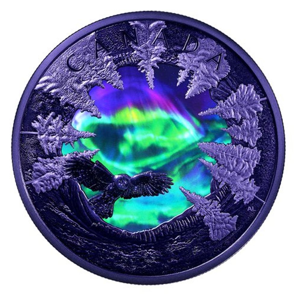 Magic of the Northern Lights Fine Silver Coin under blacklight