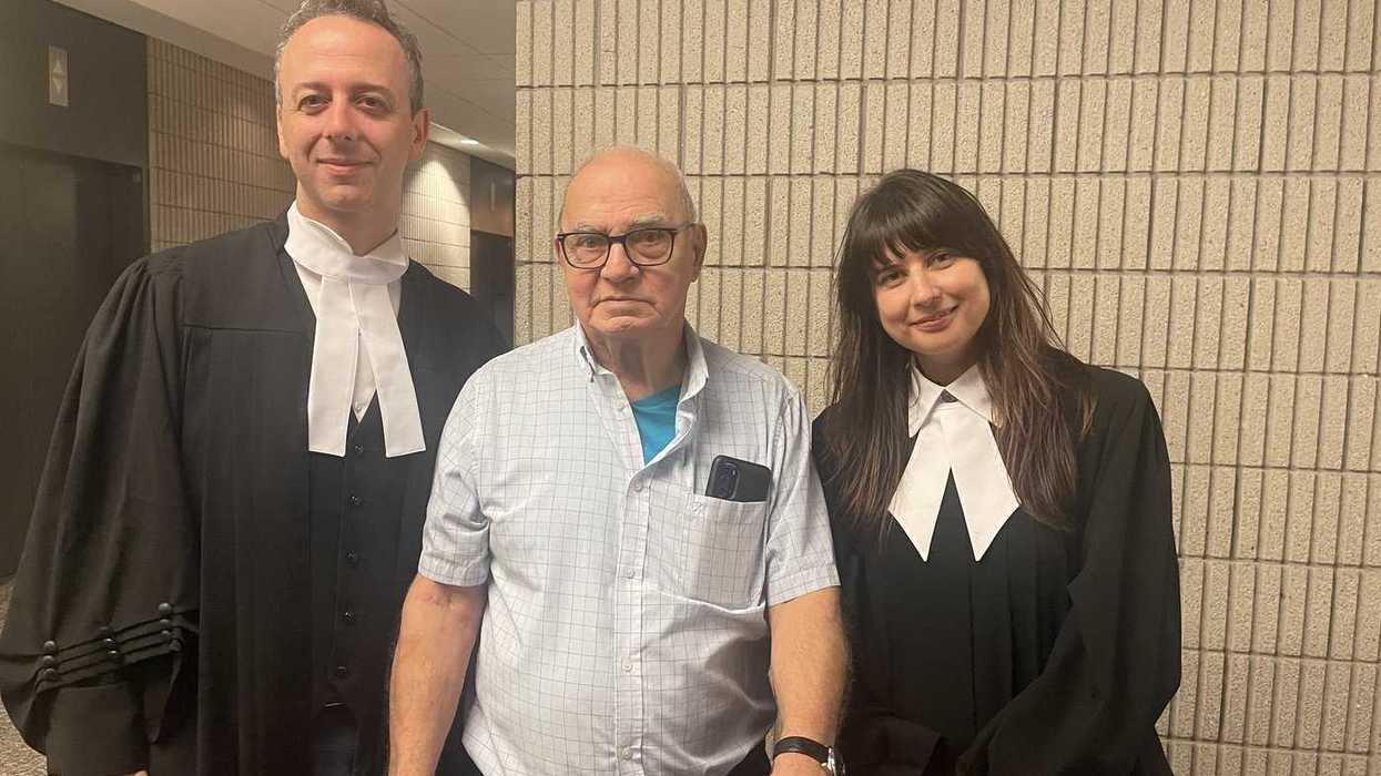 Man acquitted of historic murders gets settlement