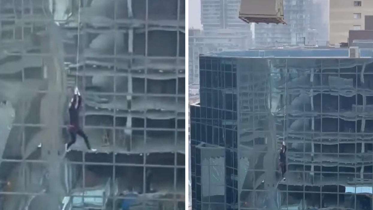 Man dangling from crane tagline.