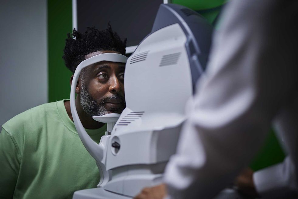 Man getting an eye exam with an optometrist.